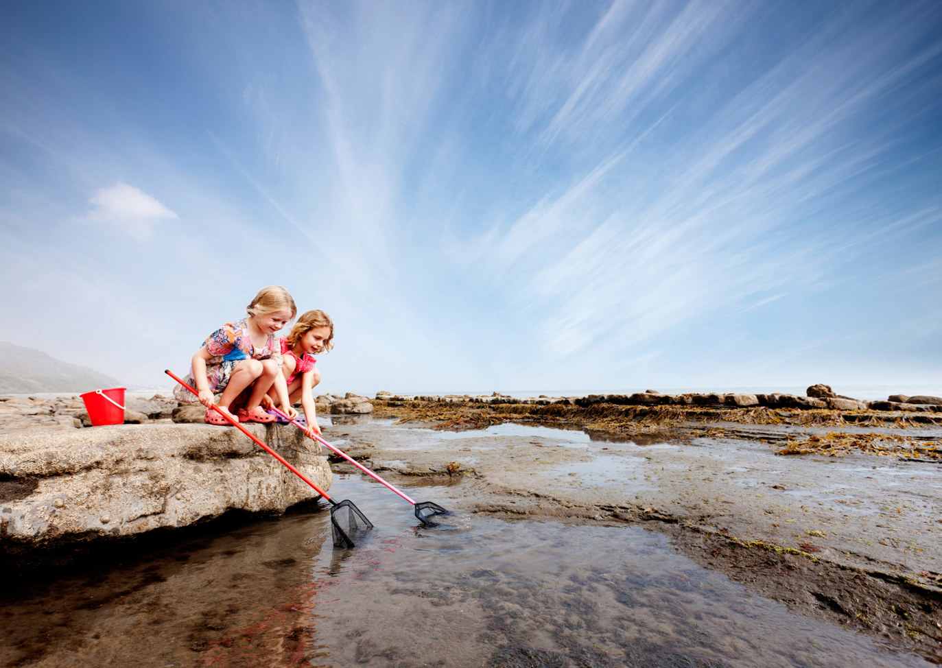 Little girls catching crabs in the sear near Finlake Resort and Spa