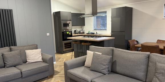 Prestige Dovecote, living room with sofas at Brokerswood