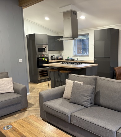 Prestige Dovecote, living room with sofas at Brokerswood