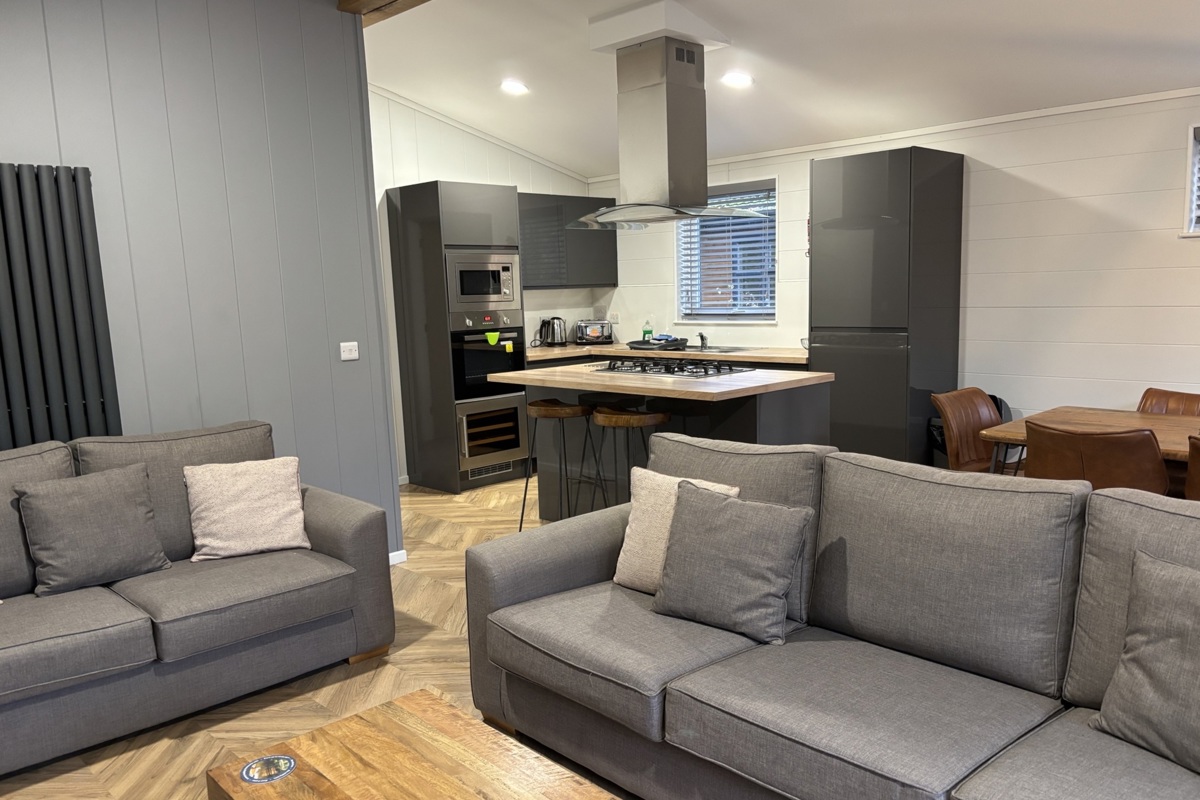 Prestige Dovecote, living room with sofas at Brokerswood