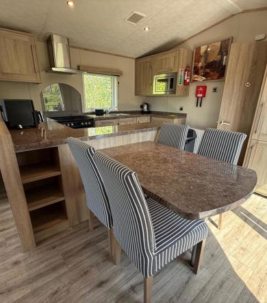 Carnaby Helmsley Lodge, dining area and kitchen at Finlake