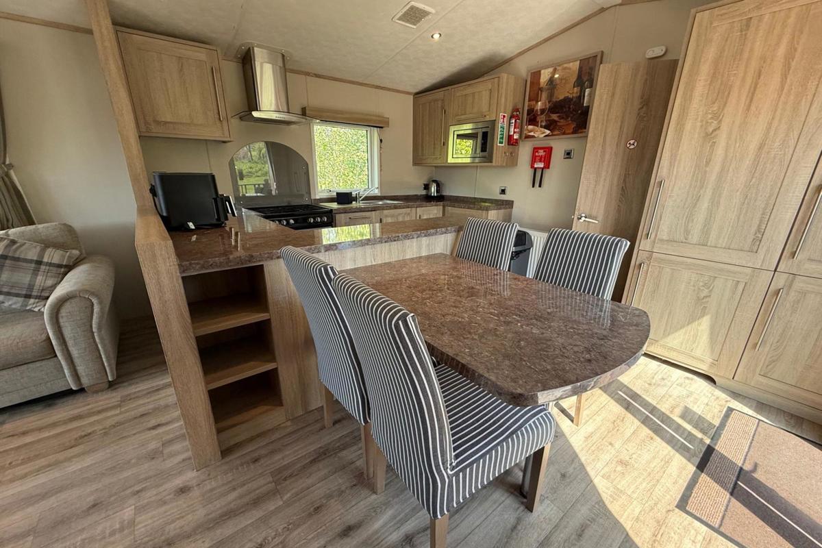 Carnaby Helmsley Lodge, dining area and kitchen at Finlake