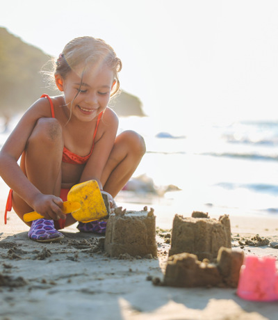 The Warren Local Area Little Girl Building A Sandcastle