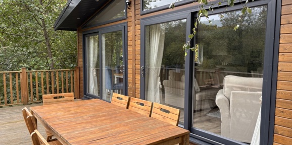 Wessex Contemporary, decking area with patio furniture at Brokerswood 