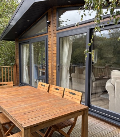 Wessex Contemporary, decking area with patio furniture at Brokerswood 