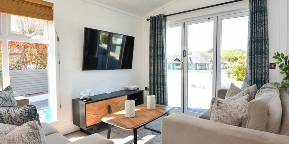Wessex Dune, living room with patio doors at The Warren