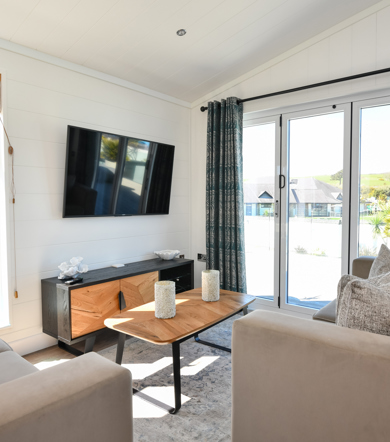 Wessex Dune, living room with patio doors at The Warren