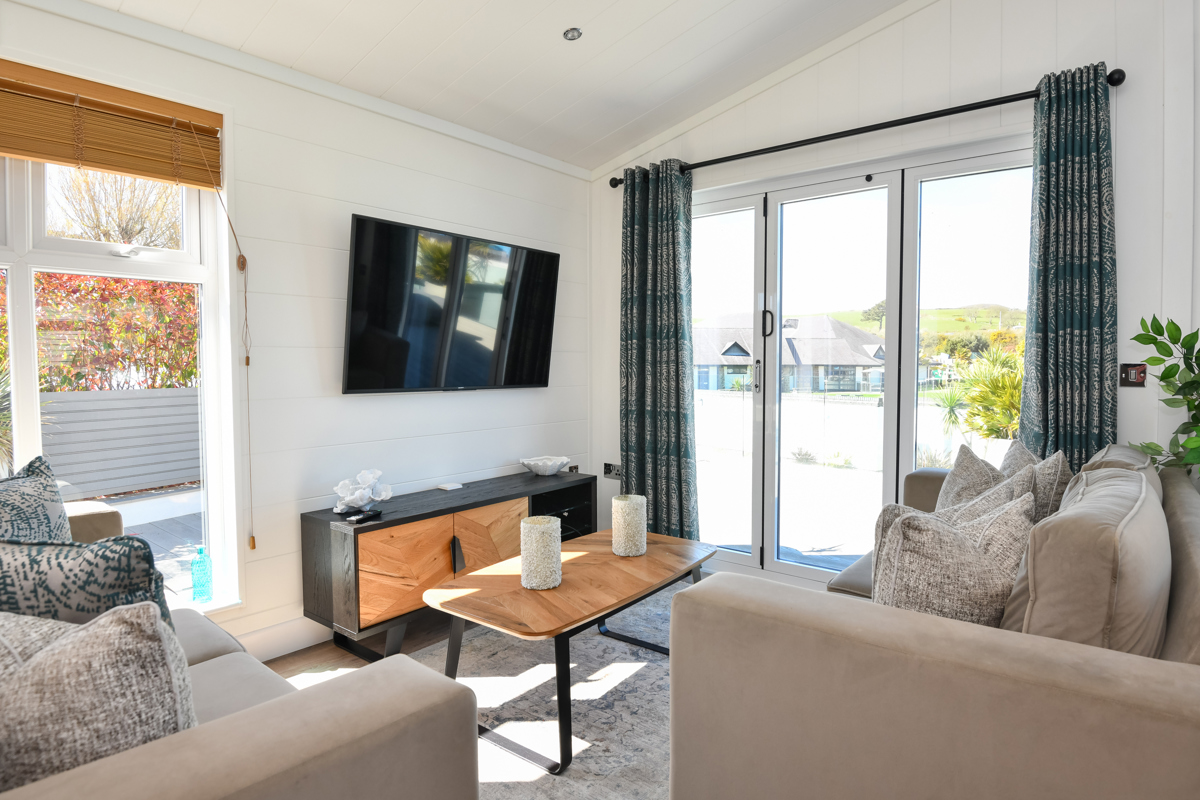 Wessex Dune, living room with patio doors at The Warren