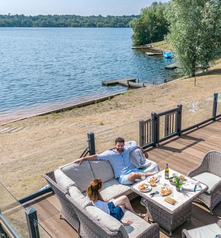 Delamere Couple On Decking At The Lodge