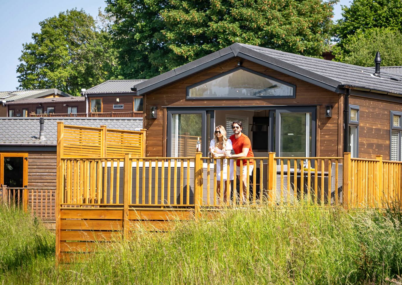 Devon Hills Couple Looking At View On Balcony