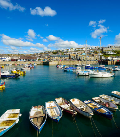 Scenic harbor site area of Porthleven, with sea side cornish house in the background near Praa Sand Holiday Park