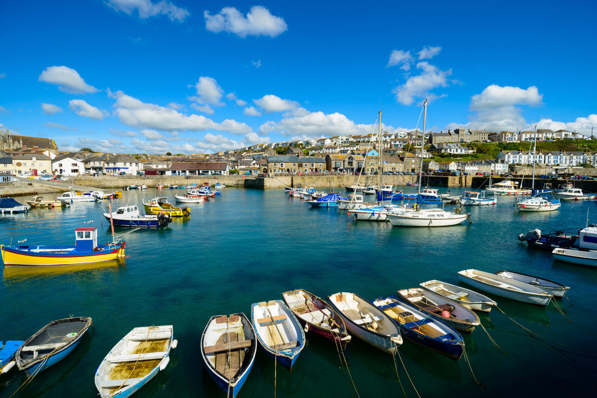 Scenic harbor site area of Porthleven, with sea side cornish house in the background near Praa Sand Holiday Park