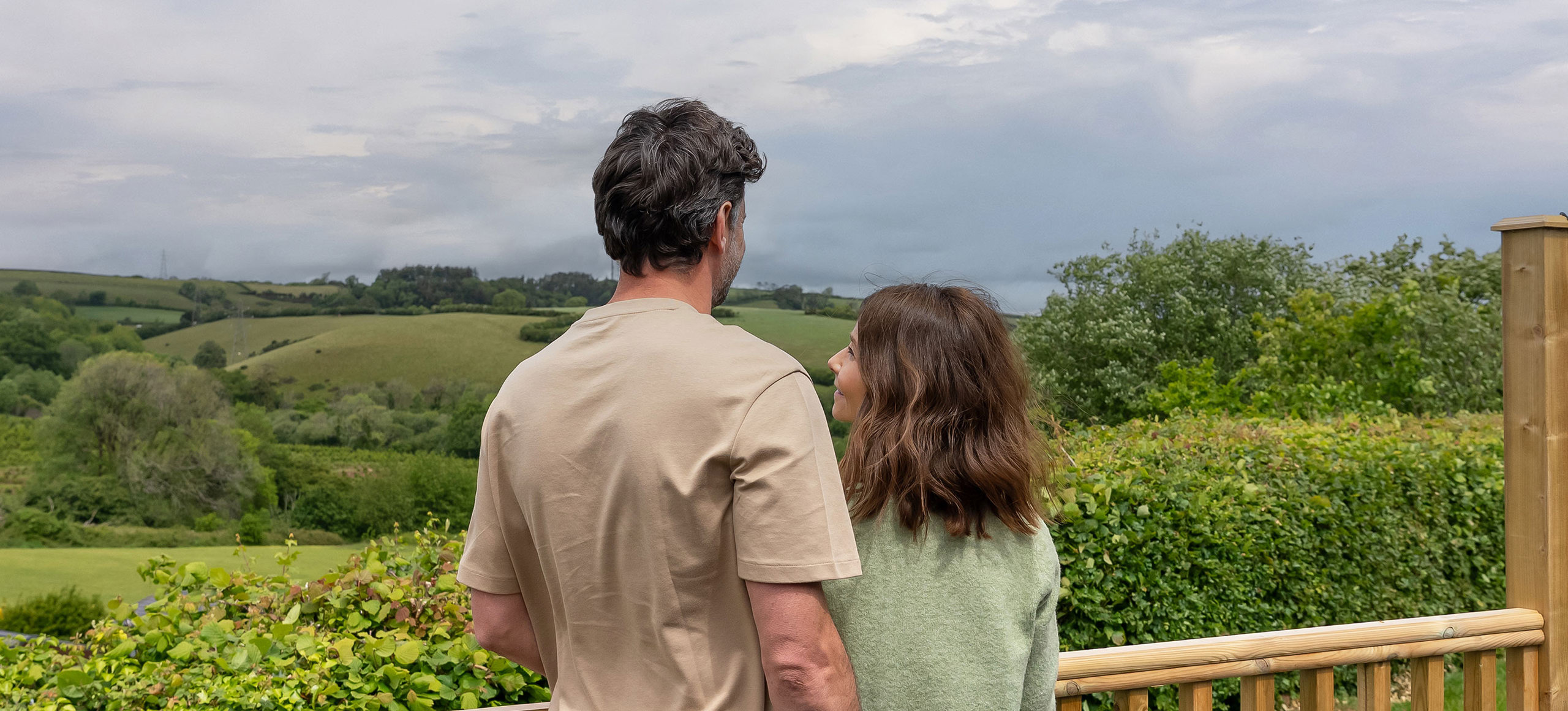 Devon Hills Meadows Development Couple On The Decking