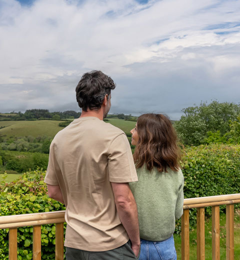 Devon Hills Meadows Development Couple On The Decking