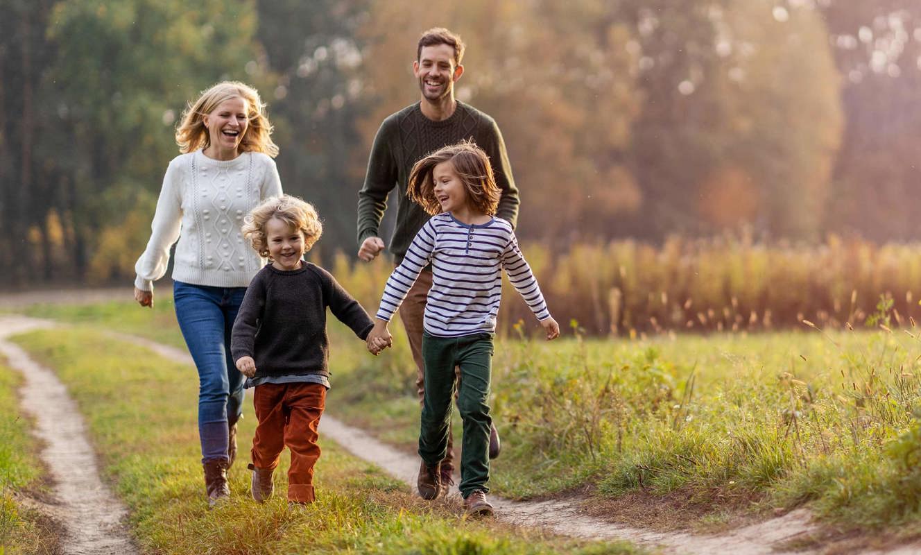 Family walking in nature reserve around Finlake