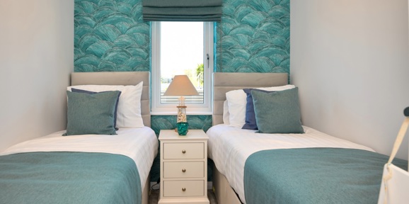 Oakgrove Osprey, green twin bedroom at The Warren