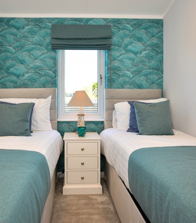 Oakgrove Osprey, green twin bedroom at The Warren