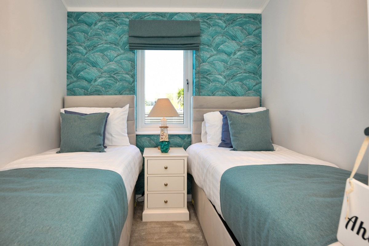 Oakgrove Osprey, green twin bedroom at The Warren