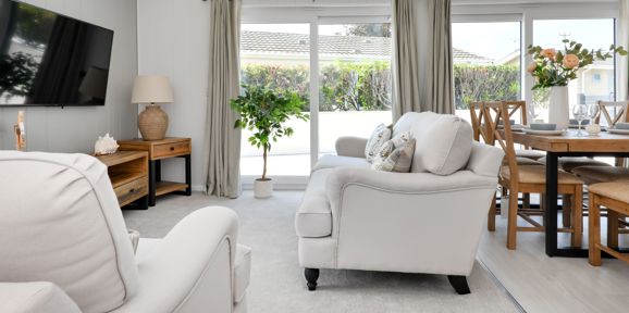 Prestige Oyster Catcher, patio doors in living room at The Warren Resort & Spa