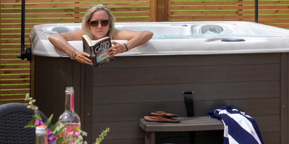 Lady reading in Hot Tub at a Dartmoor view holiday home