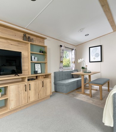 ABI Coworth, entertainment unit with TV in lounge at Finlake