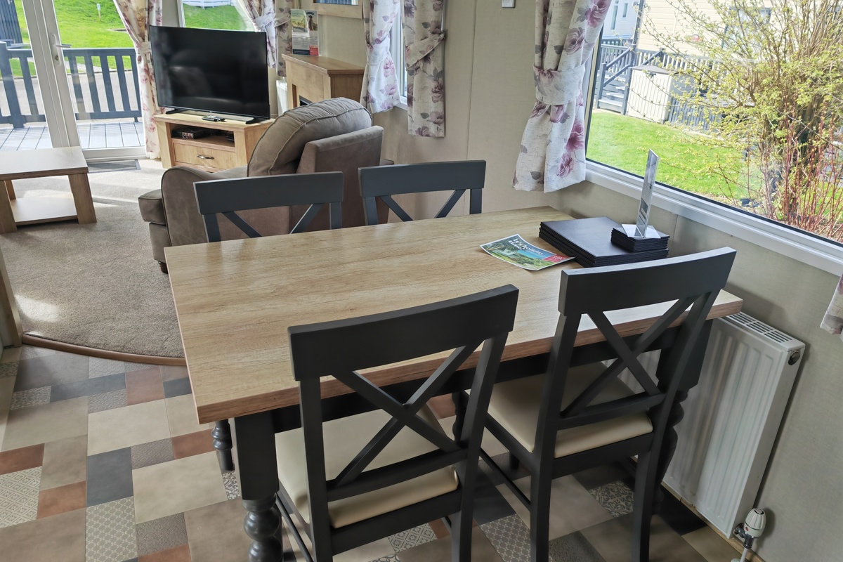 Carnaby Oakdale, table and TV at Praa Sands