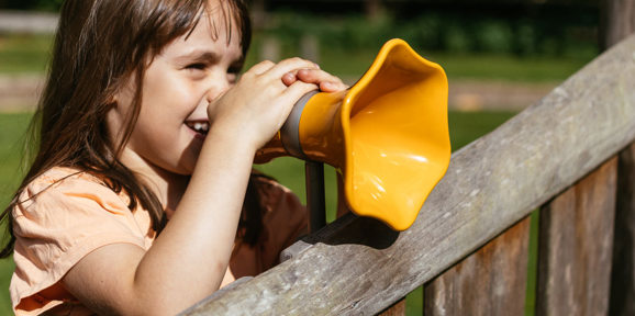 Brokerswood Girl Playing The Play Park With Noise Enhancer