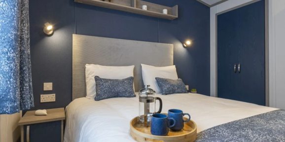 Regal Retreat, double bed in bedroom at Finlake