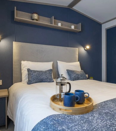Regal Retreat, double bed in bedroom at Finlake