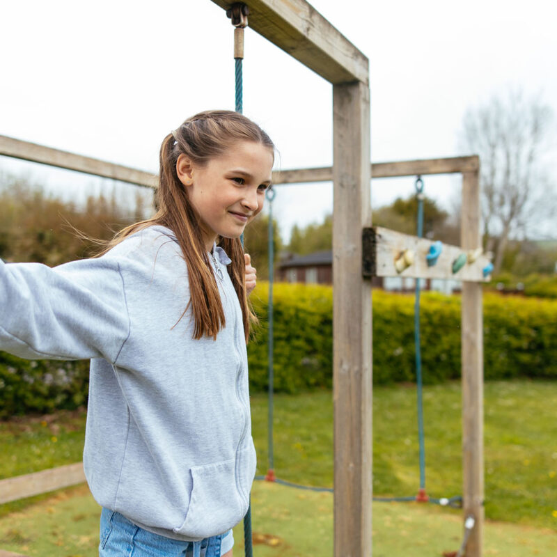 Older child enjoying a kids play area