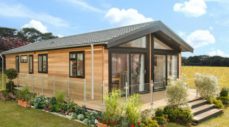 External image of the Wessex Contemporary holiday home, with a vaulted roof line, and glass end gables.