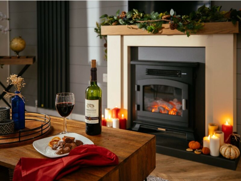 Holiday home featuring a coffee table and fireplace